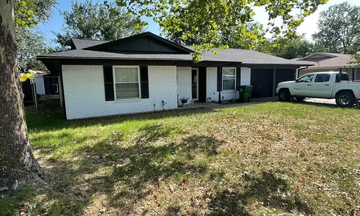 Professional roofing crew working on a residential roof in Lake Arbor